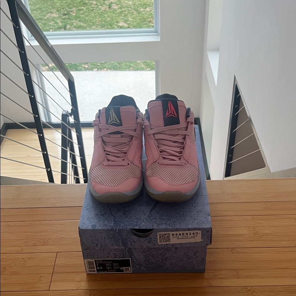 Nike Pink Low-Top Basketball Shoe with Black Swoosh